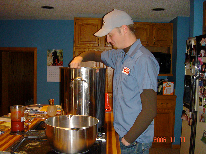 Clint, founder, brewing beer in a kitchen in 2006.