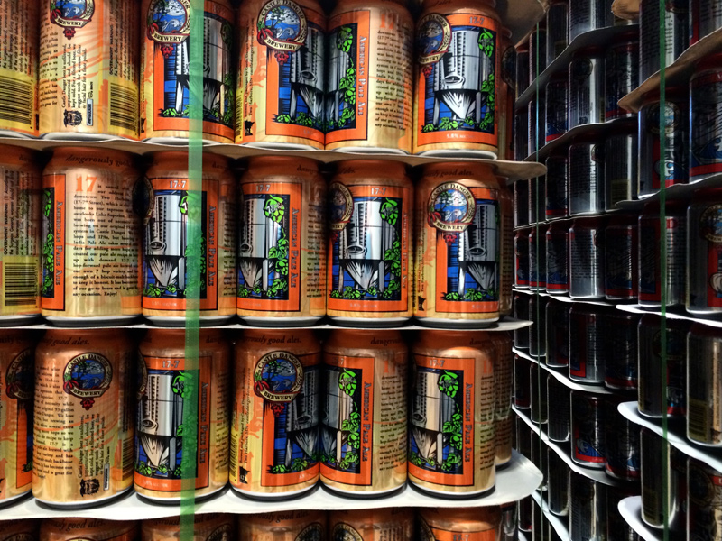 Stack of orange cans.